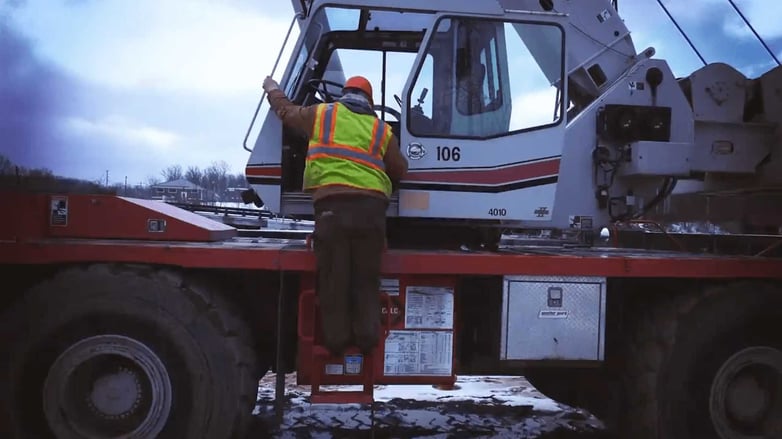 worker-getting-on-a-vehicle