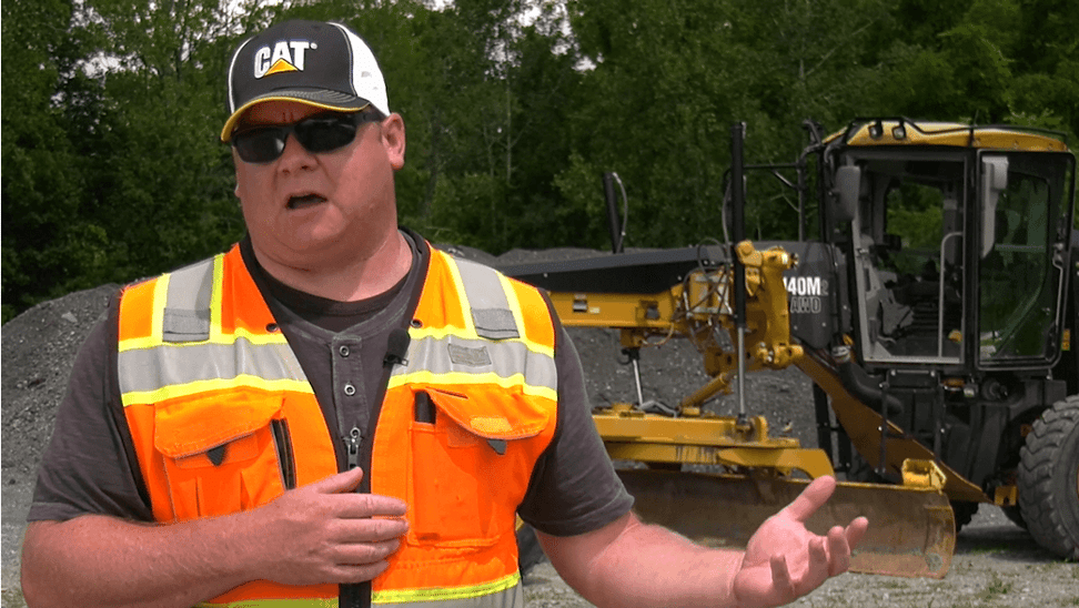 worker-with-Caterpillar-cap-with-life-vest-talking