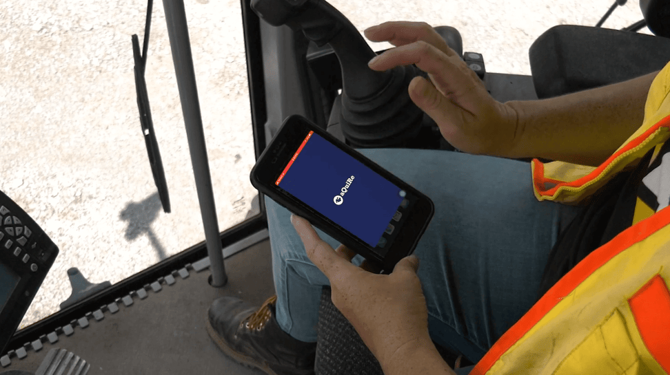 woman-with-phone-on-a-truck-aQuireapp-starting 