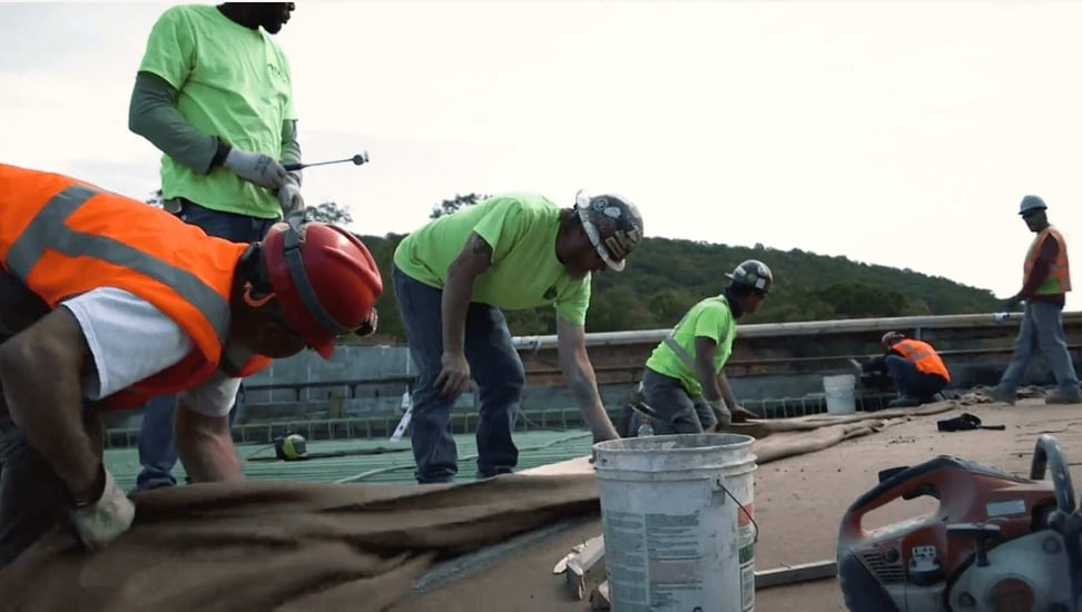 CAHill Tech. Team of construction workers work together on project